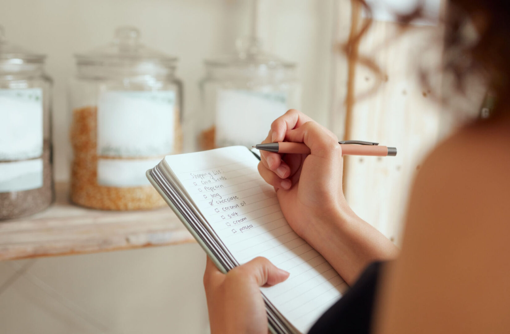 Handwriting in notebook with pen